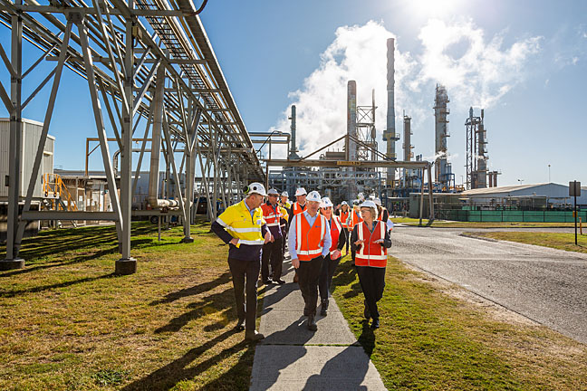 orica decarbonisation - people in front of mining infrastructure
