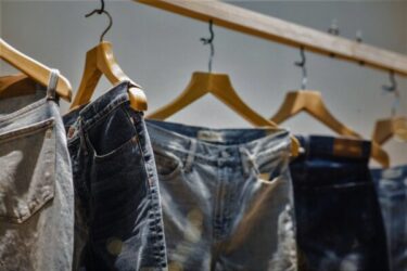 Corporate Sustainability Due Diligence Directive jeans on clothing rack