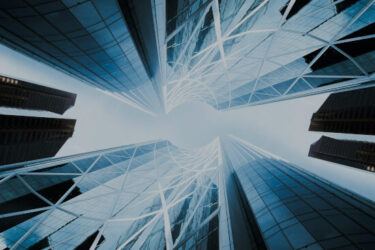 Reviewing Modern Slavery Act Compliance for a Financial Service Organisation Looking up at office blocks