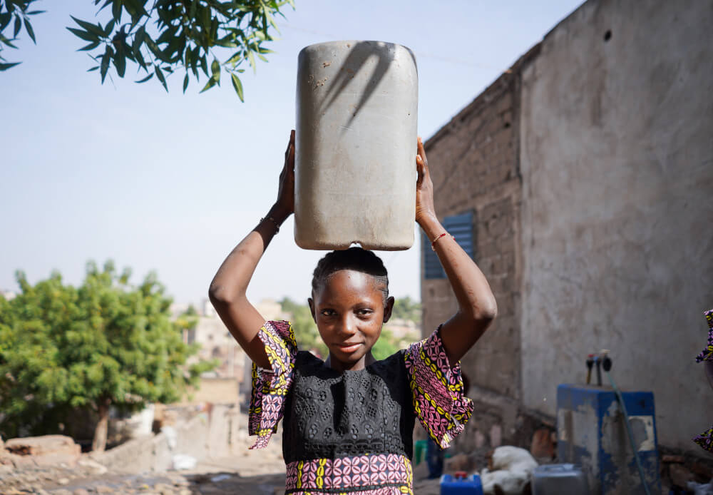 person carrying water