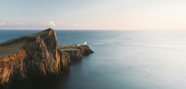 a lighthouse on the end of a peninsular