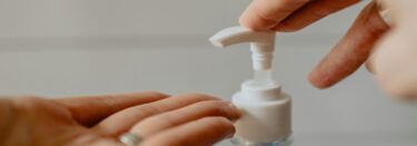 hands using a pump bottle