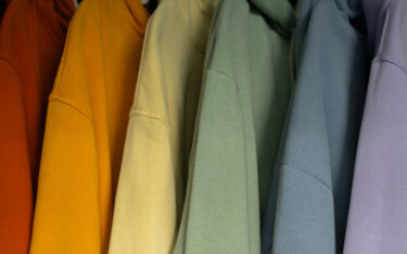 Amanda Fefferman Colourful hoodies hanging up
