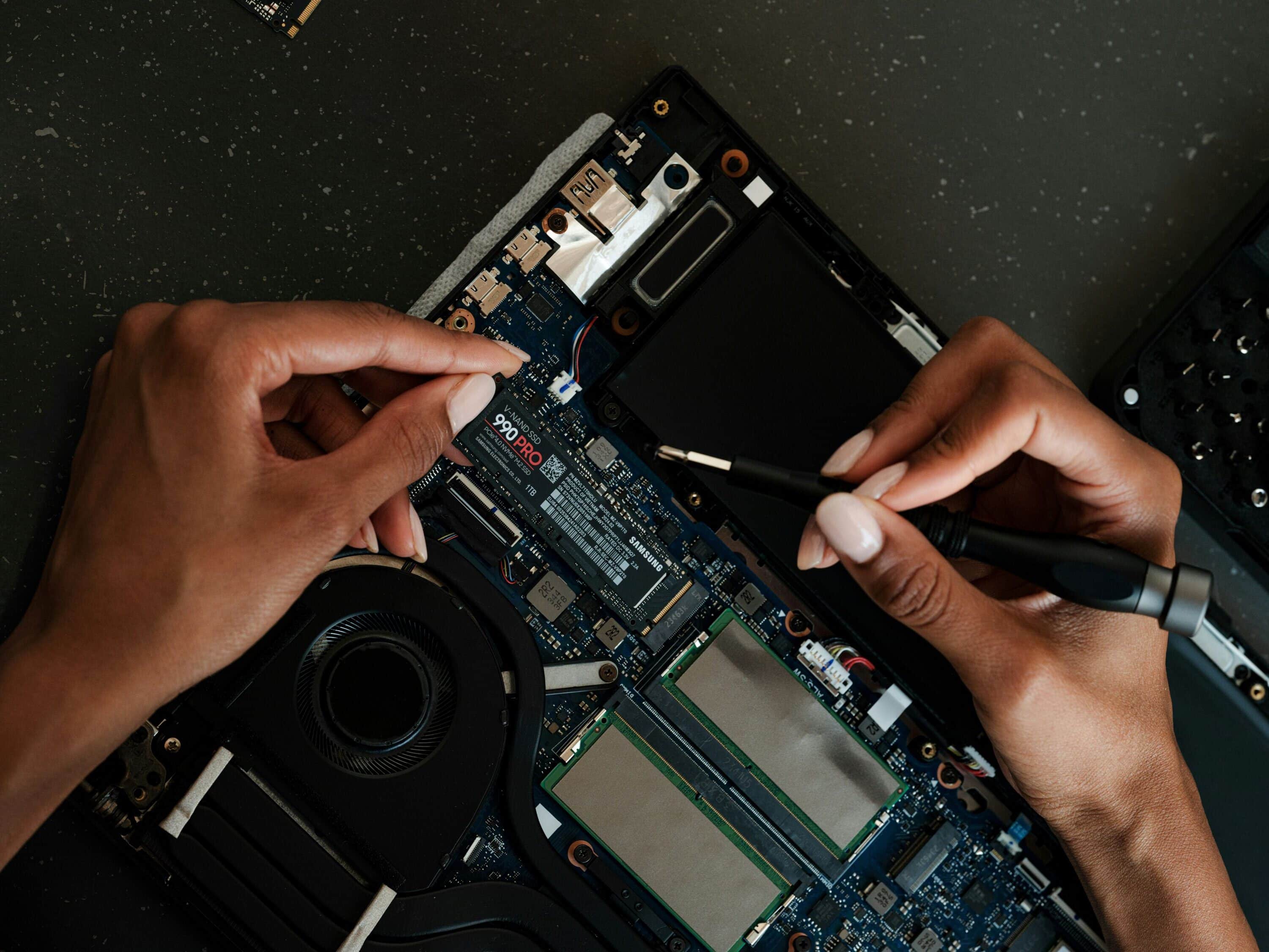 Mapping Waste Electrical Material Flow for Material Focus Person working with electronics