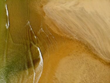 water along sandy shore