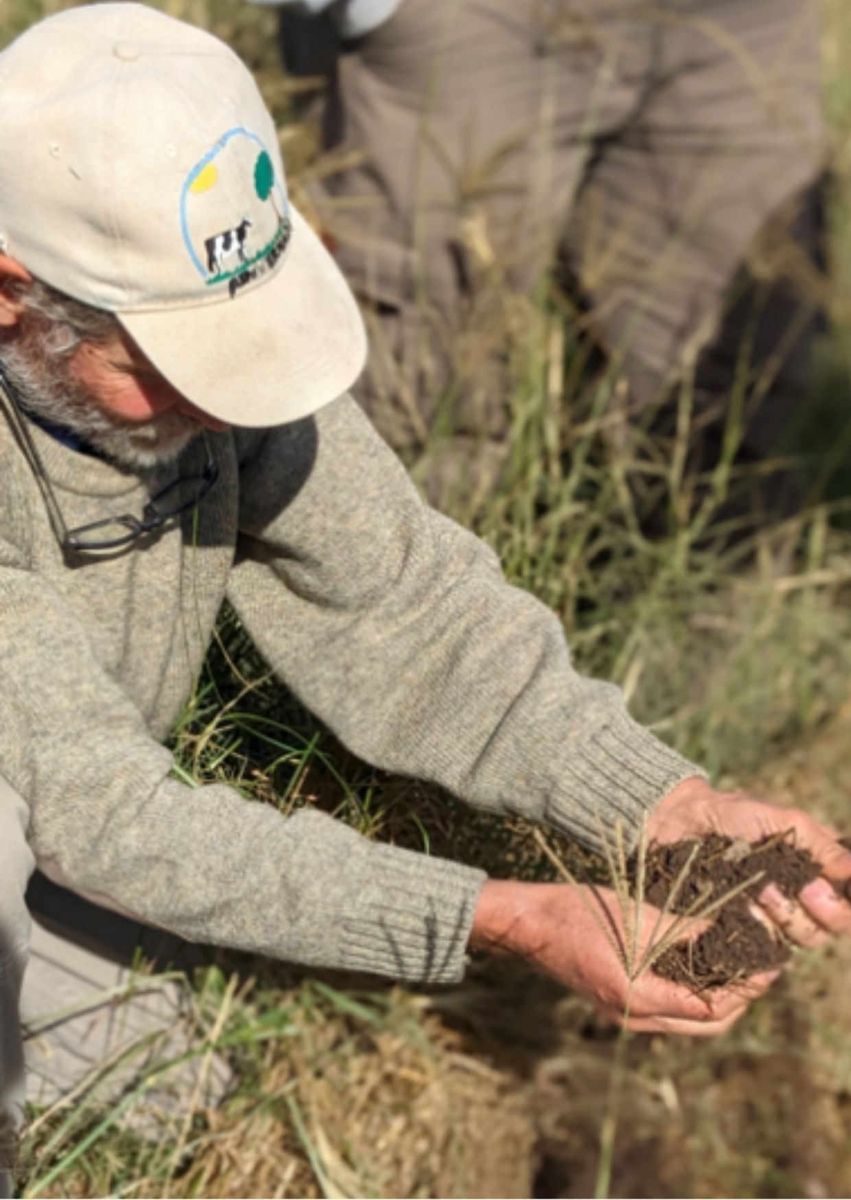 Farmer looking at soil
